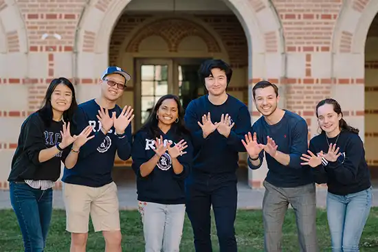 Rice Students with owl hands